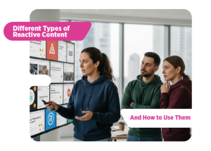 Marketing team reviewing digital content on a large screen while discussing reactive content strategies.