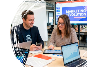 Marketing team reviewing real-time performance data and trending insights during a reactive marketing strategy session