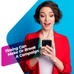 A marketer looking at her smartphone with a surprised expression, representing real-time reaction to trending content.