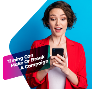 A marketer looking at her smartphone with a surprised expression, representing real-time reaction to trending content.
