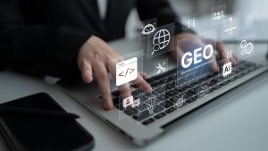 Hands typing on a laptop showcasing AI optimization strategies for SEO visibility.